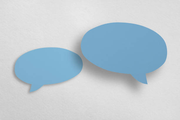 istock Speech balloon shaped blue paper isolated on white background. 1410740225
