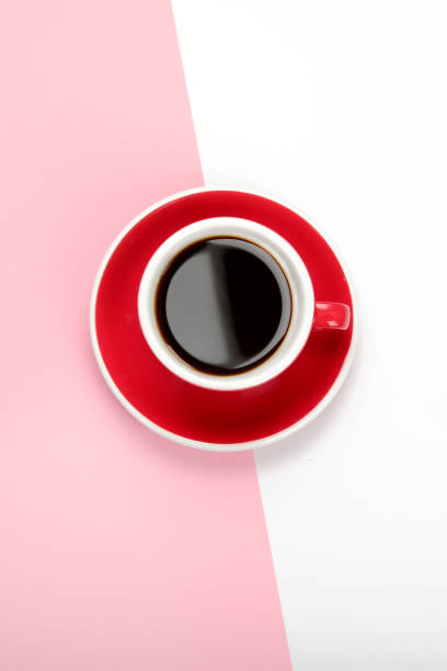 istock Coffee in red cup on color background. 1410740458