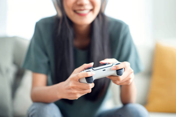istock Woman hand playing a computer games with joystick 1410742693
