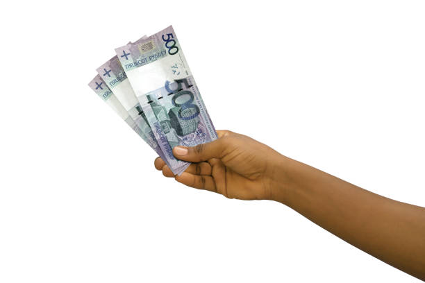 istock Fair hand holding 3D rendered Belarusian ruble notes isolated on white background 1410742771