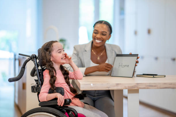 istock Speech Therapist Working with a Cerebral Palsy Patient 1410743022