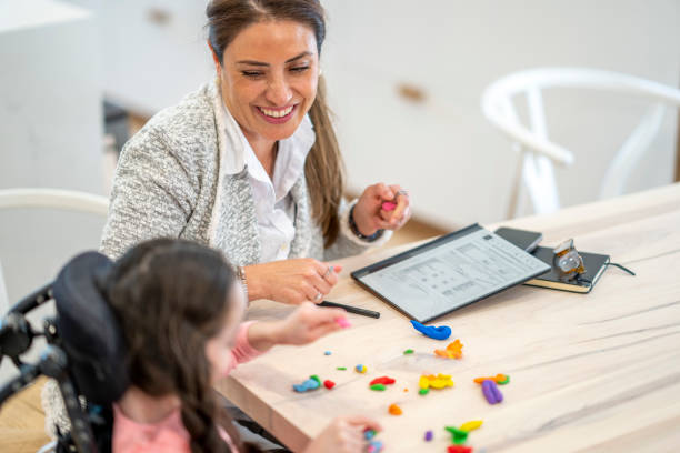 istock Therapist Working with a Cerebral Palsy Patient 1410743039