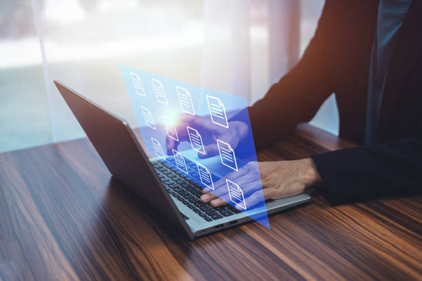 istock Businessman using ERP Enterprise Resource Planning document management concept with icons on virtual screen 1410743223