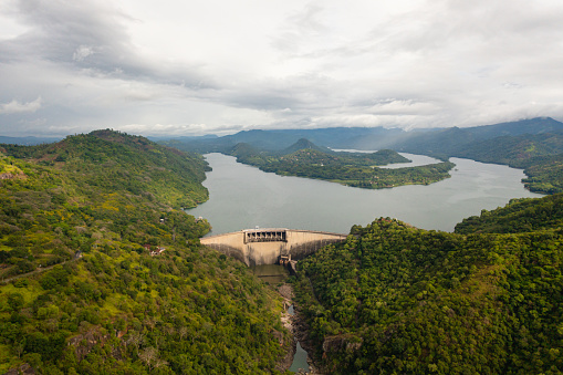 Top view of Victoria Dam on a reservoir and hydro power plant in the mountains of Sri Lanka.