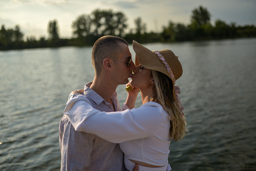 Young couple in love at the lake