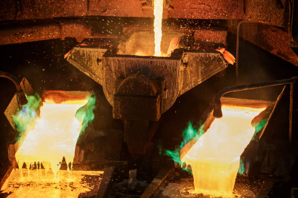 istock Process of pouring liquid hot copper into molds. 1410751862