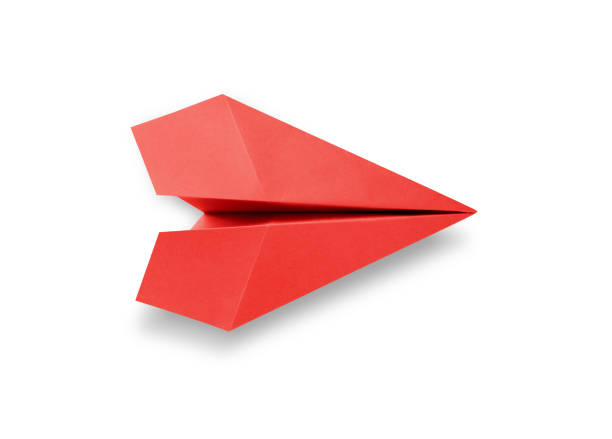 istock Red paper plane origami isolated on a white background 1410753364