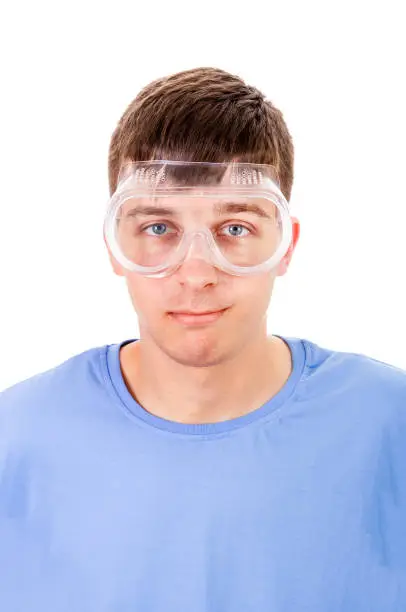 Young Man in a Safety Glasses Isolated on the White Background