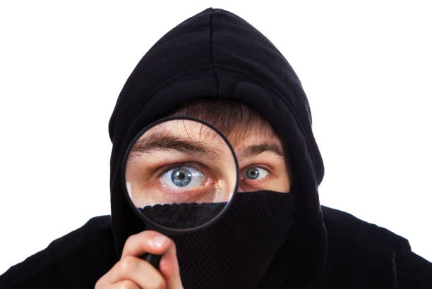 man with a magnifying glass - snooper imagens e fotografias de stock