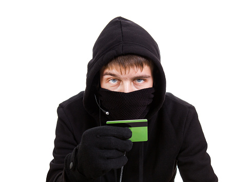 Hacker hold a Bank Card Isolated on the White Background