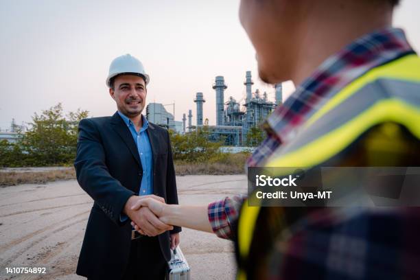 Businessman And Engineer Meeting And Discuss Project In Working Site Teamwork Project Concept Stock Photo - Download Image Now