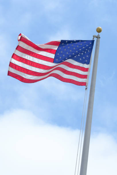 istock American flag - Color Portrait Format 1410756316