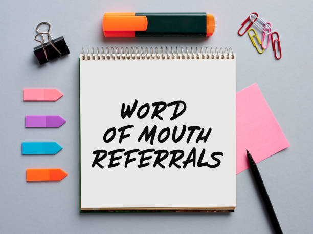 istock The phrase word of mouth referrals written on a notebook on office desktop. 1410757185