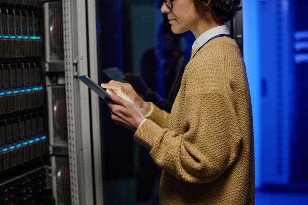 istock Young woman engineer at the network equipment 1410757459