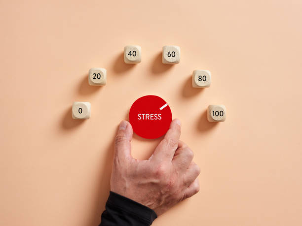 istock Hand turning stress level meter indicating high level of stress. 1410757543