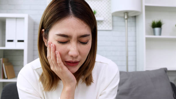 istock Asian woman suffering from toothache, Cavities or tooth decay concept 1410758863