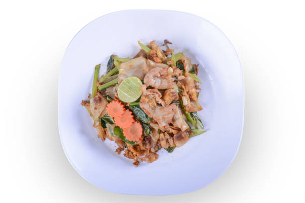 Stir-fried Noodles in Sweet Soy Sauce with Pork ( Pad See-Ew ) on white bowl for Thai food and isolate background with clipping path Stir-fried Noodles in Sweet Soy Sauce with Pork ( Pad See-Ew ) on white bowl for Thai food and isolate background with clipping path beef pad stock pictures, royalty-free photos & images