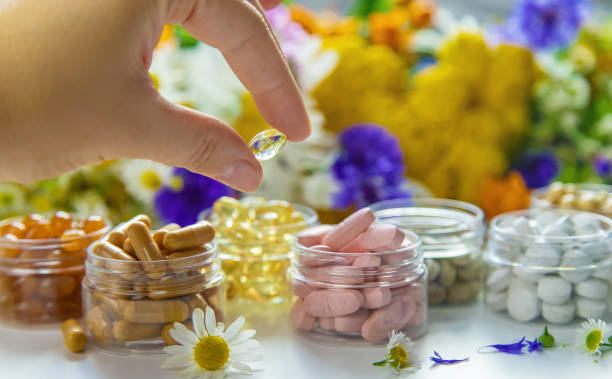 istock Homeopathy and dietary supplements from medicinal herbs. Selective focus. 1410759863
