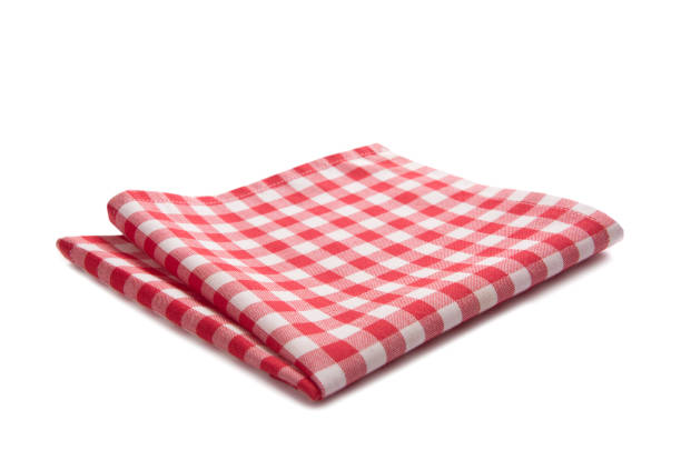istock Red checkered folded cloth isolated.Picnic kitchen towel on white background. 1410759942