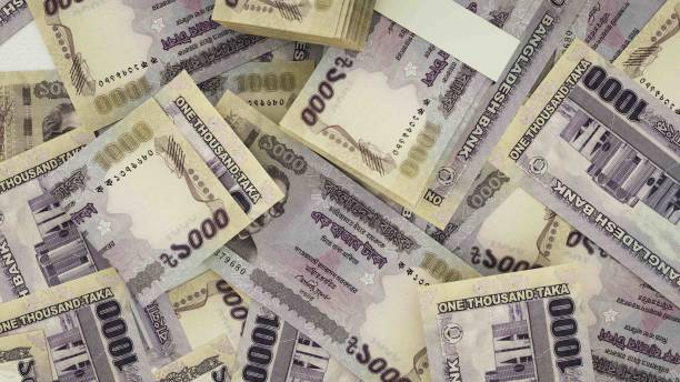 istock 3D rendering of 1000 Bangladeshi taka notes spread on surface 1410760211