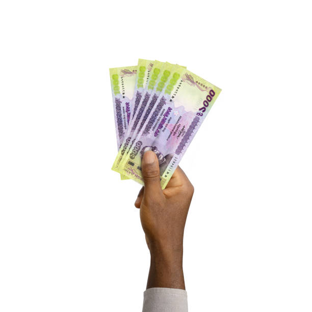 istock Black Hand holding 3D rendered 1000 Bangladeshi taka notes 1410760233