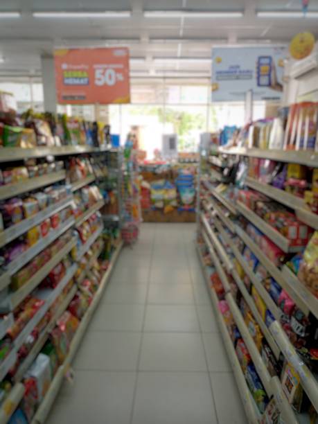 istock Supermarket aisle and shelves defocused background 1410761070