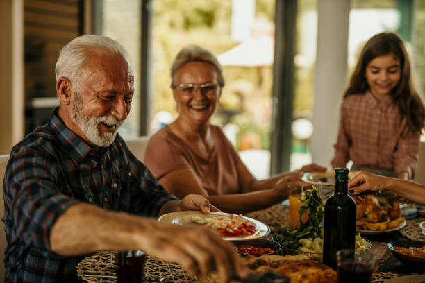 istock Grandparents spending lunch time with a granddaughter 1410762469