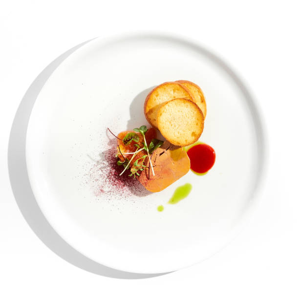 istock Chicken liver pate with toasted bread and jam isolated on white background. Meat terrine with citrus and toast. Restaurant food - duck pate with baguette on white plate. Meat appetizer. 1410762579