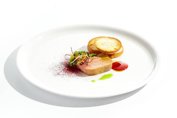 istock Chicken liver pate with toasted bread and jam isolated on white background. Meat terrine with citrus and toast. Restaurant food - duck pate with baguette on white plate. Meat appetizer. 1410762637