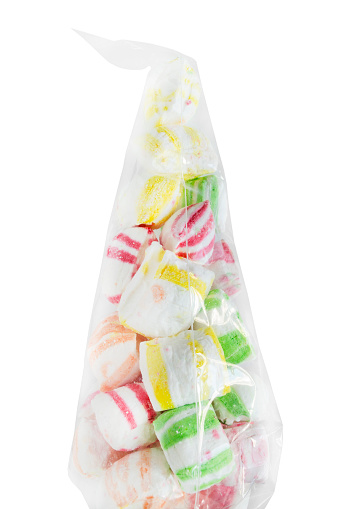 Colorful marshmallow candies in plastic pack isolated on white background