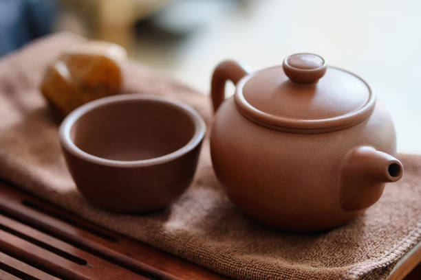istock Chinese brown clay teapot and cup 1410766149