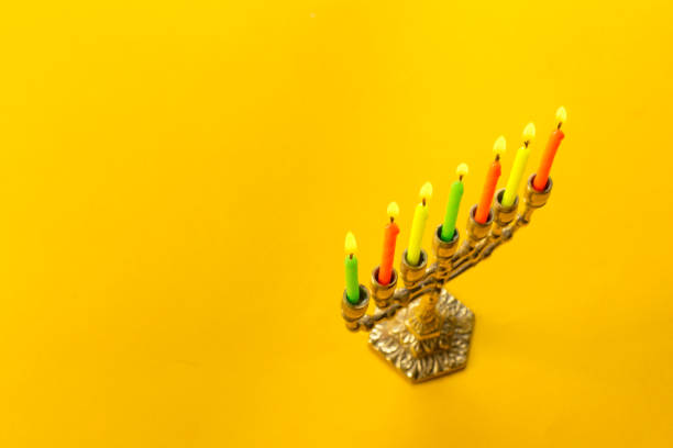 istock Bronze Hanukkah menorah with burning candles 1410766872