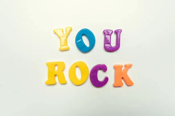 Photo of You rock compliment in colorful letters close up