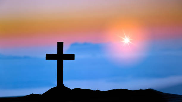 istock Silhouette Cross on the mountains 1410772985