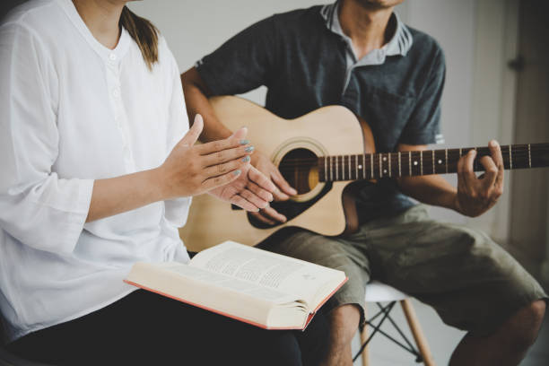 istock Christian family groups praying with Holy Bible. 1410773045