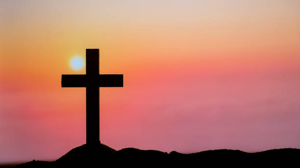istock Silhouette Cross on the mountains 1410773063