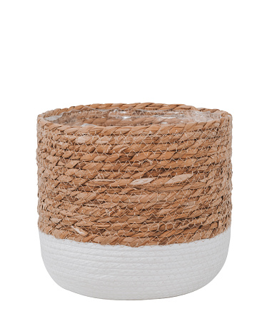 Empty trendy design handwoven seagrass and cotton belly basket can use as cachepot. Round storage basket in braided straw with white cotton, isolated on white background with clipping path