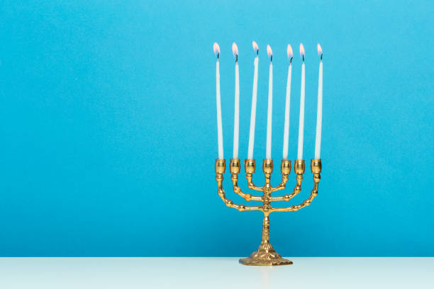 istock Bronze Hanukkah menorah with burning candles 1410778729