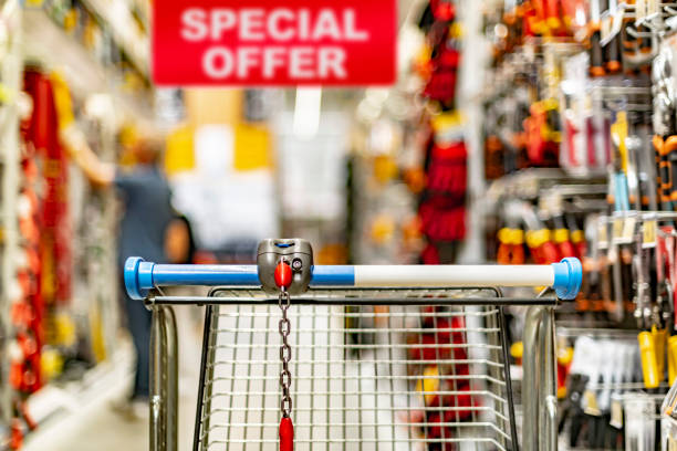istock A shopping cart by a store shelf in a hardware store 1410779358