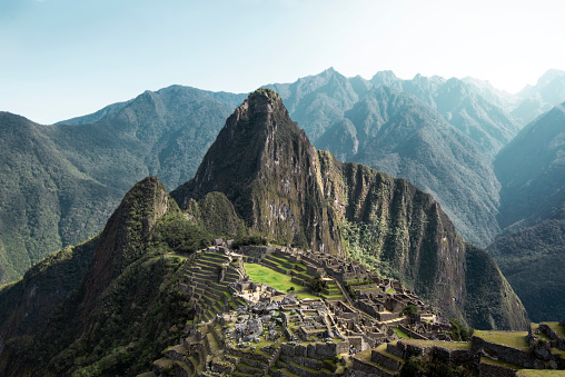 Man visiting the incredible panoramic views of the Inca ruins of Machu Pichu in the Andes of Peru
