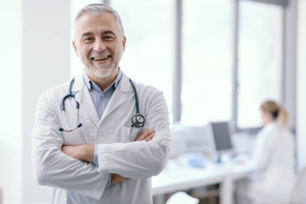 istock Confident doctor posing with arms crossed 1410783251