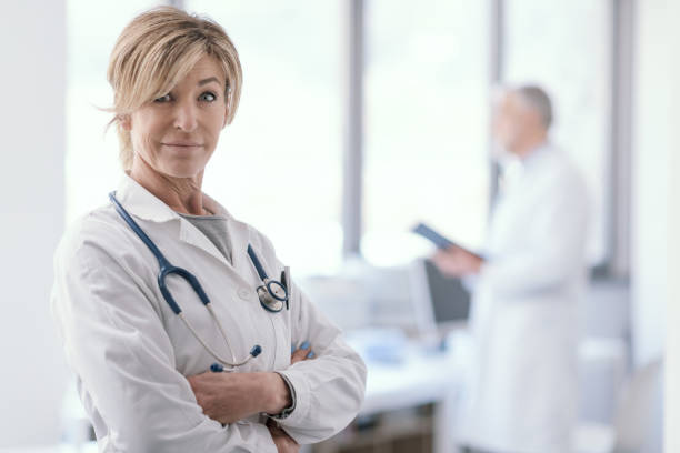 istock Female doctor posing in the office 1410783966