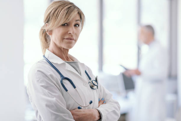 istock Female doctor posing in the office 1410786072