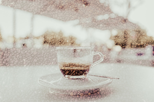 Multiple exposure of an Espresso coffee on a table outdoors, and a coffee bean background