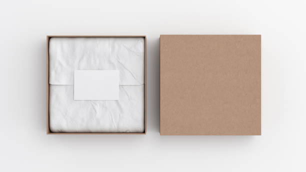 Square gift box mock up. Cardboard gift box with blank label or business card on wrapping paper. White background. View directly above. Square gift box mock up. Cardboard gift box with blank label or business card on wrapping paper. White background. View directly above. 3d illustration square business card mockup stock pictures, royalty-free photos & images