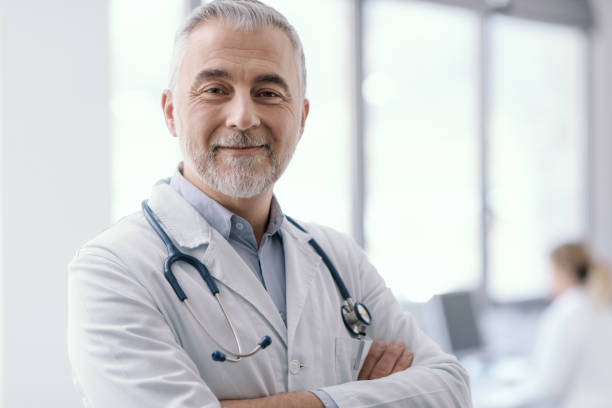 istock Confident doctor posing with arms crossed 1410786252