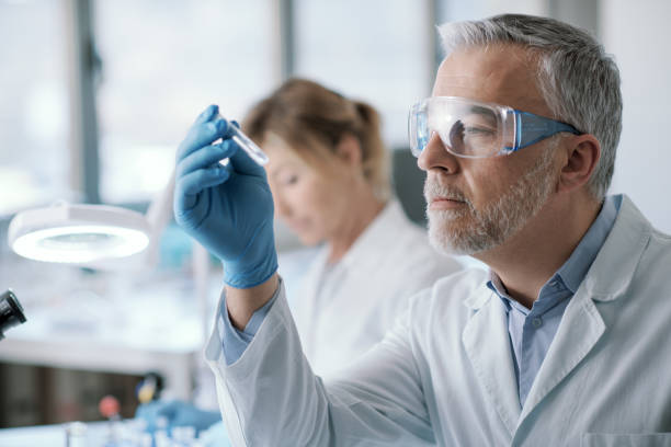 istock Professional researcher holding a test tube 1410786276