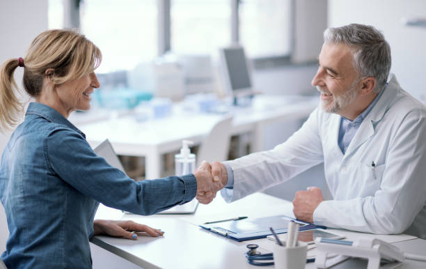 istock Doctor and patient shaking hands 1410786307