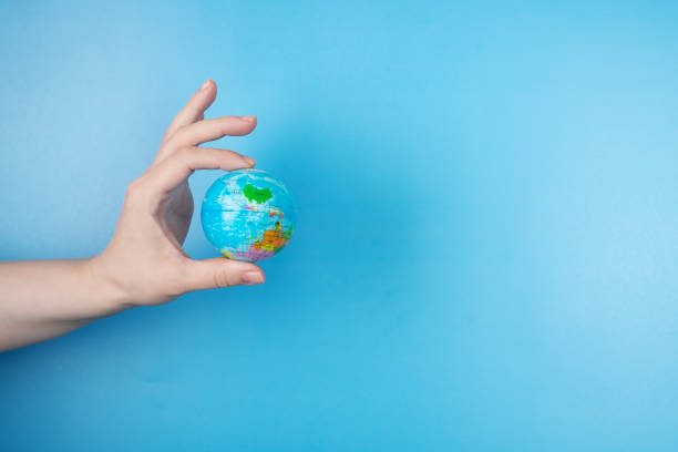 istock renewable energy , ecology concept, environmental care, hand with globe 1410786941