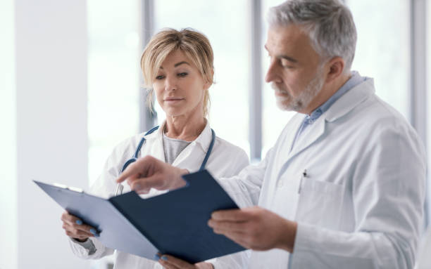 istock Doctors checking medical records in the office 1410787056